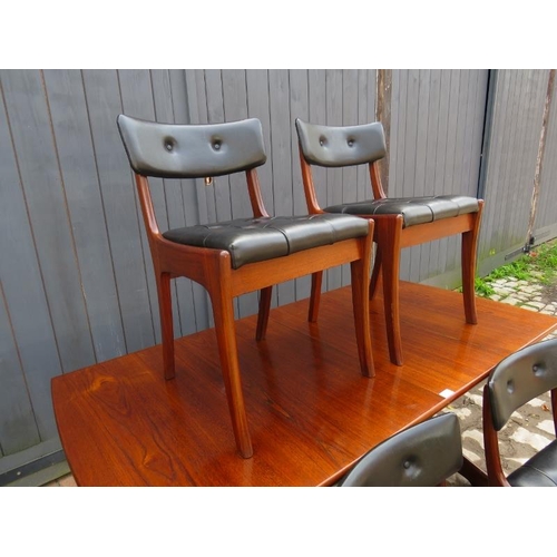 854 - A mid-century teak extending dining table by Vansen, with central folding butterfly leaf, on shaped ... 