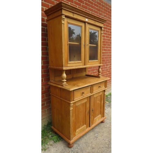 857 - A vintage French pine kitchen dresser, the top with glazed cupboard and loose shelf, with cupboard u... 