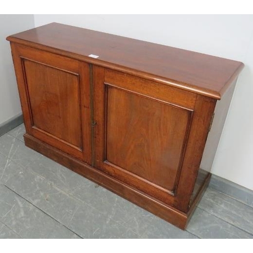 866 - A Victorian mahogany low side cabinet, the panelled doors opening onto two height adjustable shelves... 