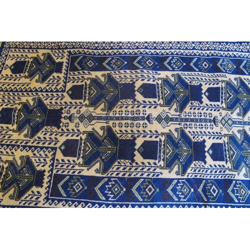 923 - A small Persian rug blue on cream ground. Condition okay. 125cm x 75cm (approx).