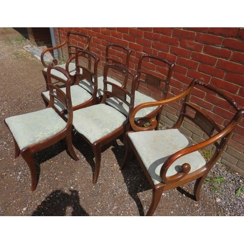 877 - A set of seven (5+2) Regency period mahogany sabre leg dining chairs with rope carved back rests and... 