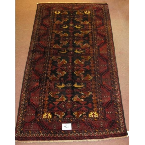 920 - Meshed Belouch rug, a central patterned field with stylised birds, blue/deep red. Good condition and... 