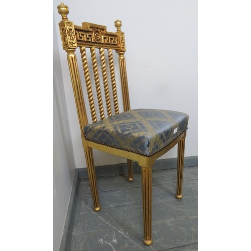 875 - A vintage giltwood opera chair with blue and gold patterned silk upholstery, on reeded supports with... 