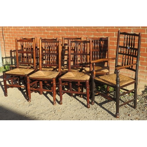 878 - A set of eight (7 + 1) 19th century elm Lancashire spindle back farmhouse kitchen chairs with rush s... 