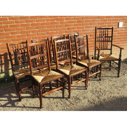 878 - A set of eight (7 + 1) 19th century elm Lancashire spindle back farmhouse kitchen chairs with rush s... 