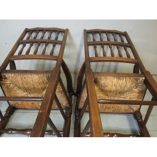 879 - A set of eight (6 + 2) Georgian style Lancashire oak framed spindle back rush seated dining chairs.
... 