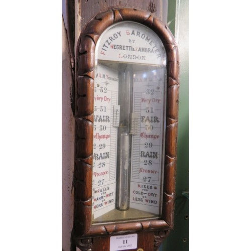 11 - An antique Negretti & Zambra Fitzroy barometer in ornate oak case. Height 108cm.
Condition report: C... 