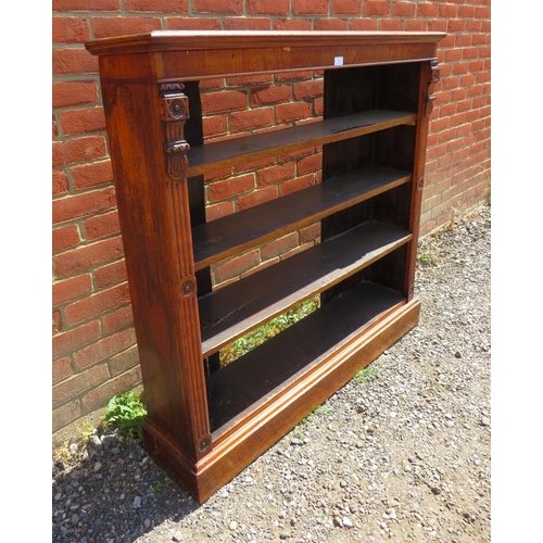 848 - A 19th century walnut low open bookcase of three height adjustable shelves, flanked by reeded column... 