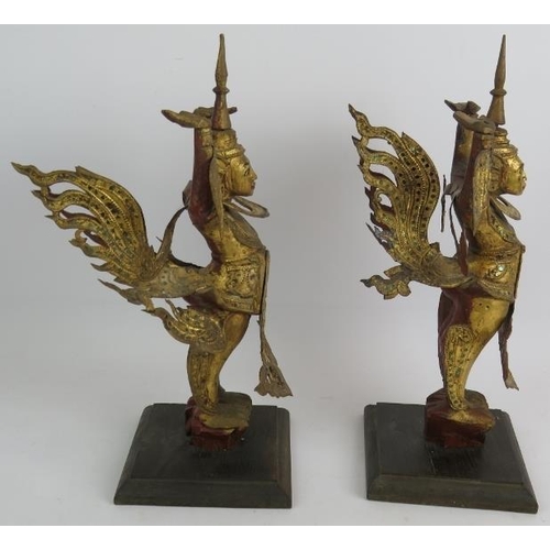 101 - A pair of gilt wood and metal Asian dancers, mounted on hardwood pedestals. Height 40cm. (pr).
Condi... 