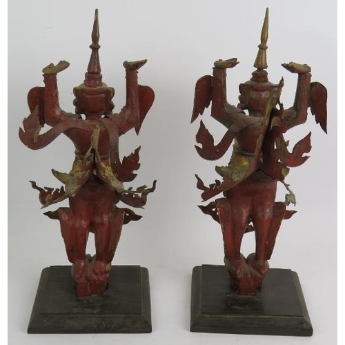 101 - A pair of gilt wood and metal Asian dancers, mounted on hardwood pedestals. Height 40cm. (pr).
Condi... 