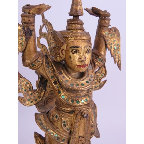 101 - A pair of gilt wood and metal Asian dancers, mounted on hardwood pedestals. Height 40cm. (pr).
Condi... 