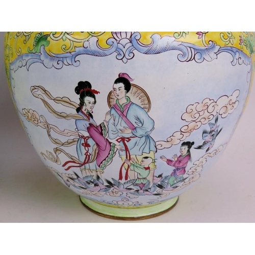 104 - A pair of Chinese Cantonese enamel vases hand decorated with traditional scenes set on a yellow back... 