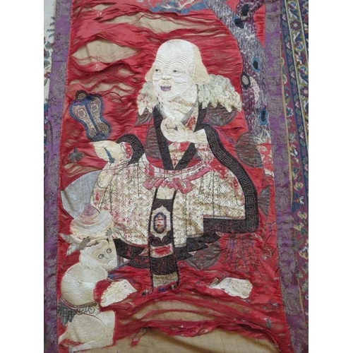 107 - A late 19th century Chinese silk wall hanging depicting a seated sage (170cm x 75cm) and a similar s... 