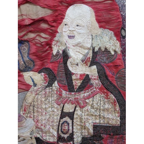 107 - A late 19th century Chinese silk wall hanging depicting a seated sage (170cm x 75cm) and a similar s... 