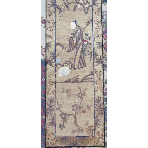 107 - A late 19th century Chinese silk wall hanging depicting a seated sage (170cm x 75cm) and a similar s... 