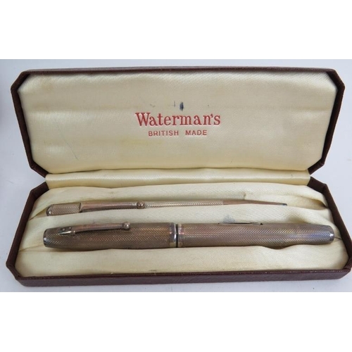 111 - A boxed sterling silver Waterman's fountain pen and pencils and a sterling silver Shaeffer fountain ... 