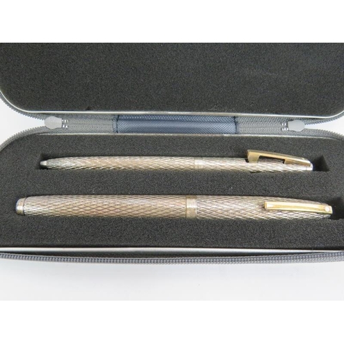 111 - A boxed sterling silver Waterman's fountain pen and pencils and a sterling silver Shaeffer fountain ... 