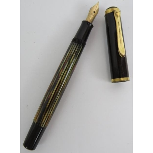 114 - A vintage Gunther Wagner Pelikan fountain pen with Stresemann striped body and 14k gold nib.
Conditi... 