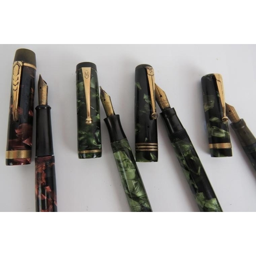 115 - Four vintage marbled fountain pens including a Mentmore auto-flow, an Onoto the pen Delarue & Co Lon... 