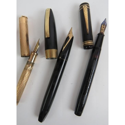 115C - A gold plated Shaeffer fountain pen, a Wahl gold plated small fountain pen, a black Shaeffer fountai... 