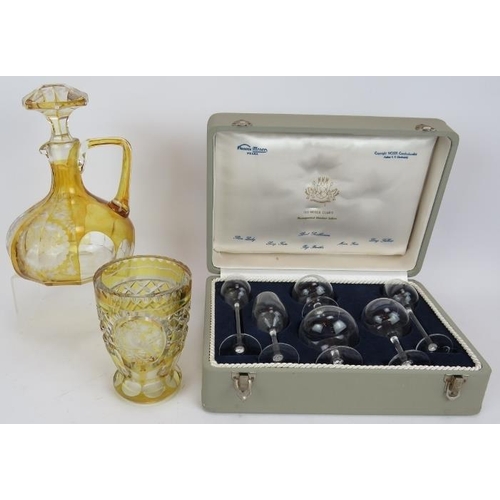 121 - A 1950s boxed set of the Moser Club's physiognomical miniature snifter glasses, a Bohemian amber fla... 