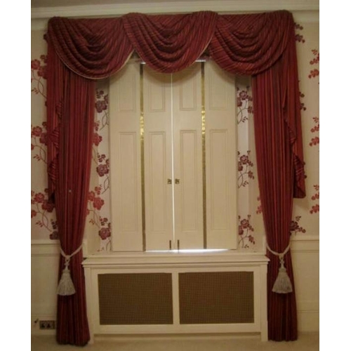 124 - A good quality pair of red Regency striped curtains, fully lined with triple festoon pelmet. Each cu... 