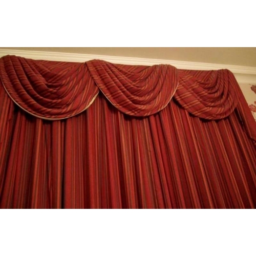 124 - A good quality pair of red Regency striped curtains, fully lined with triple festoon pelmet. Each cu... 