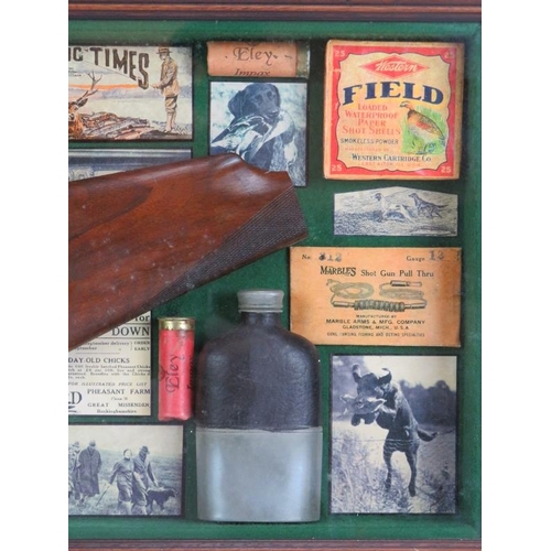 129 - A cased montage of shooting related collectables including a shotgun stock, hip flask, labels, photo... 