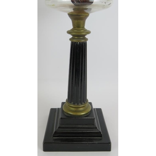 134 - An antique oil lamp with reeded column base, slice cut clear glass reservoir and etched globe shade.... 