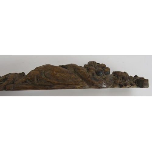 136 - An antique carved oak caryatid of robed figure, probably 17th/18th century. Height 58cm. Width 7.5cm... 