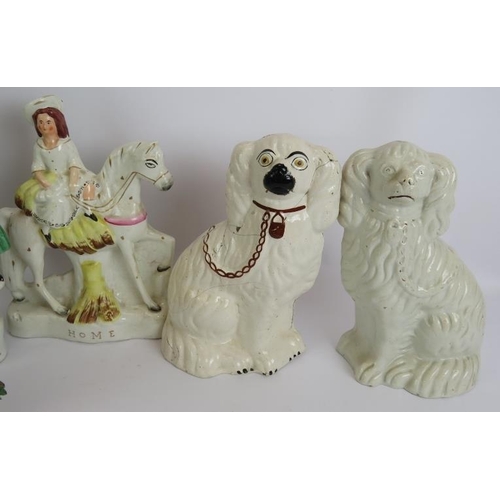 137 - Twelve antique Staffordshire pottery figures including a pair of lustre spaniels, two brightly decor... 