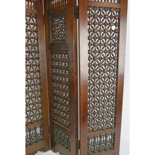 144 - A four fold North African hardwood screen with bobbin turned lattice work. Height 88cm.
Condition re... 