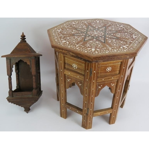 146 - An Anglo-Indian folding coffee table, 20th century, profusely inlaid with bone marquetry throughout,... 