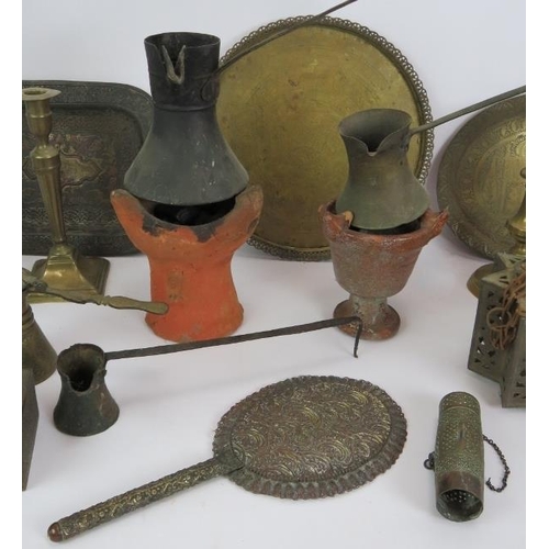 152 - A quantity of mainly Eastern brass ware including plates, coffee pots, box, grinder, mirror etc and ... 