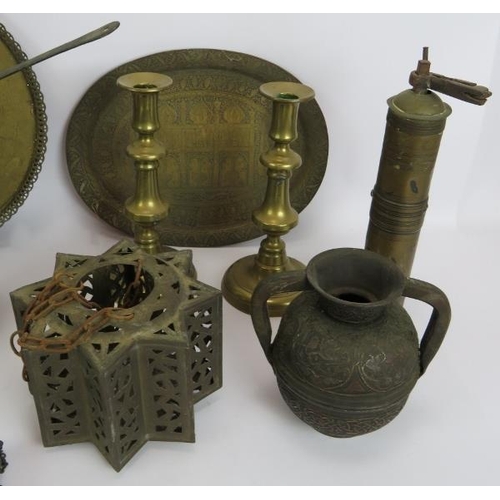 152 - A quantity of mainly Eastern brass ware including plates, coffee pots, box, grinder, mirror etc and ... 