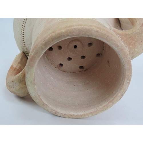 153 - A lidded terracotta amphora with internal drain. Height 34cm.
Condition report: Chip to lid finial.