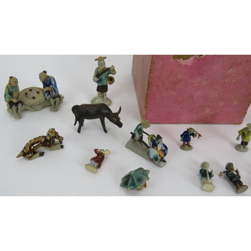 154 - A collection of miniature Chinese ceramic figures of humans and animals, most partly glazed. Tallest... 