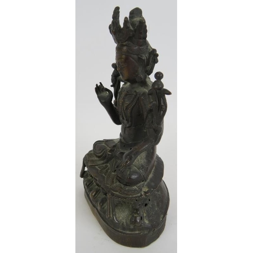 16 - A small antique Chinese bronze Deity figure, hollow cast. Height 17cm.
Condition report: Some histor... 