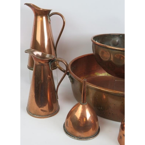 166 - A large antique copper pan, copper bowl, 3 copper jugs, funnel, cup and long pan. Largest pan 46cm d... 