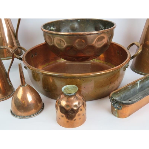 166 - A large antique copper pan, copper bowl, 3 copper jugs, funnel, cup and long pan. Largest pan 46cm d... 