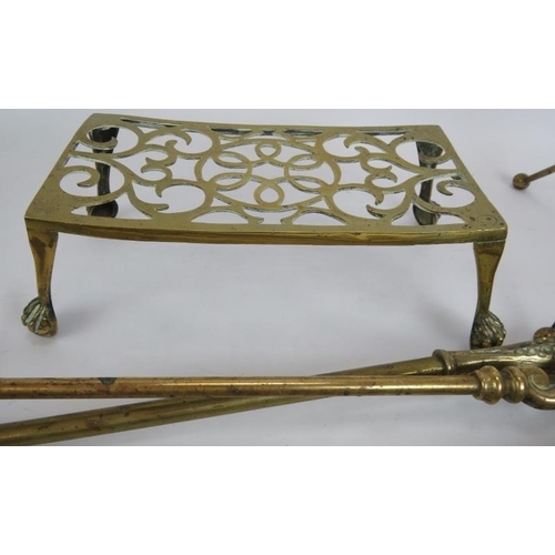 167 - A copper coal scuttle, pair of brass fire dogs, two sets of fire irons, two tripod folding trivets a... 