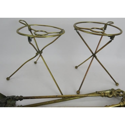 167 - A copper coal scuttle, pair of brass fire dogs, two sets of fire irons, two tripod folding trivets a... 