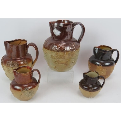 186 - Five Stoneware harvest jugs of varying sizes, two marked Doulton and a Stoneware dish with sgraffito... 