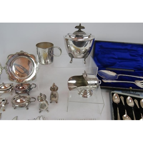 192 - A quantity of mainly antique silver plated wares including a tea caddy, fish cutlery, condiments, tw... 