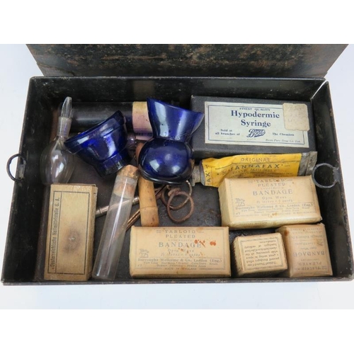 194 - An early 20th century Burroughs Wellcome Tabloid brand medicine chest and contents in black toleware... 