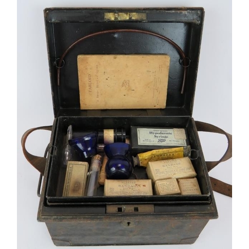 194 - An early 20th century Burroughs Wellcome Tabloid brand medicine chest and contents in black toleware... 