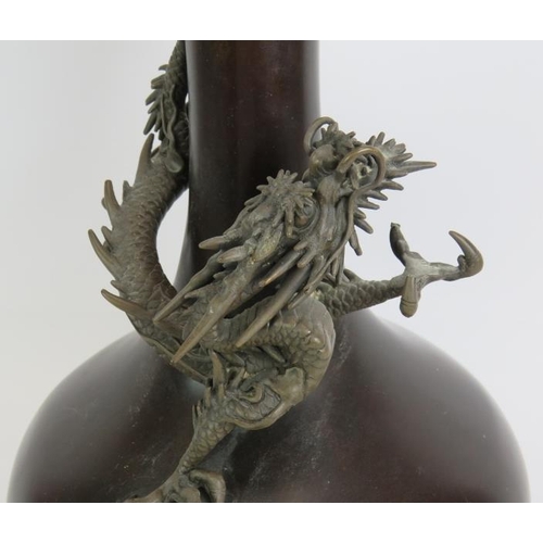 2 - A large bronze Japanese baluster vase with a finely modelled dragon. Late Meiji period. Height 39cm.... 