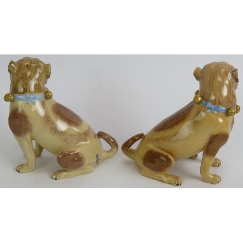 20 - A pair of Dresden porcelain pug dog figures, hand decorated and marked, and a Wallenderfer German po... 