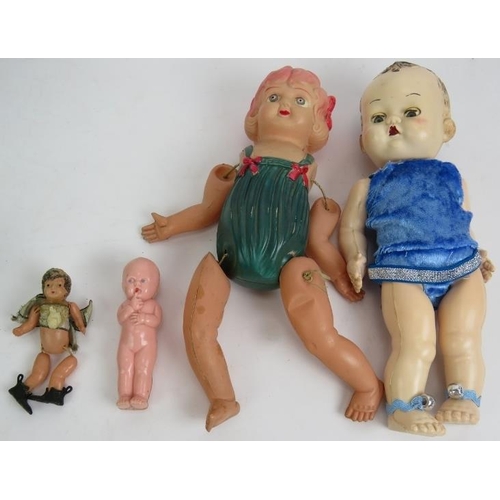 200 - Four vintage plastic dolls including one Japanese and one Pedigree, a pair of continental hand decor... 