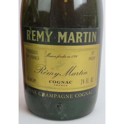 212 - A litre bottle of Courvoisier 3 star cognac, a vintage bottle of Remy Martin Vsop Cognac and a vinta... 